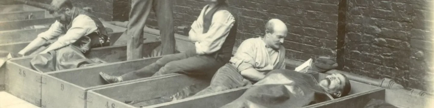 Photo showing conditions for London men who were homeless, sleeping in coffin boxes