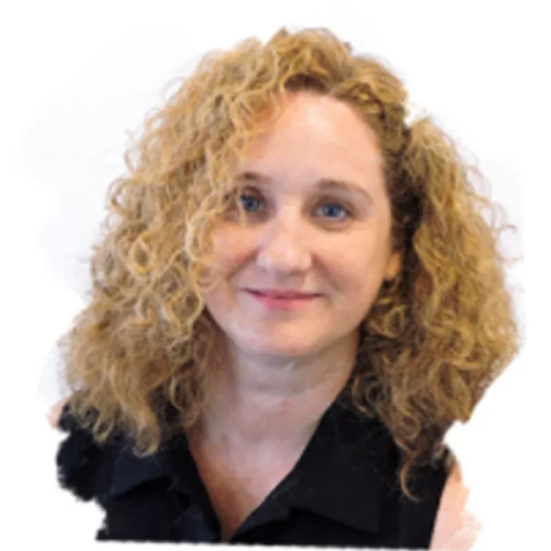 A woman with blonde curly hair, wearing a black sleeveless top, smiling.