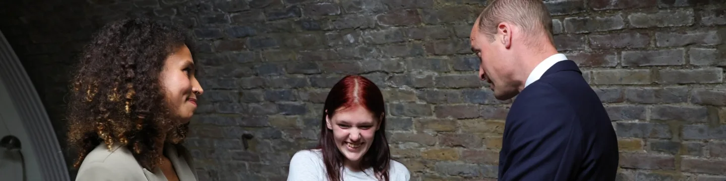 Prince William with our client Lainey and her Support Worker, Sophie.