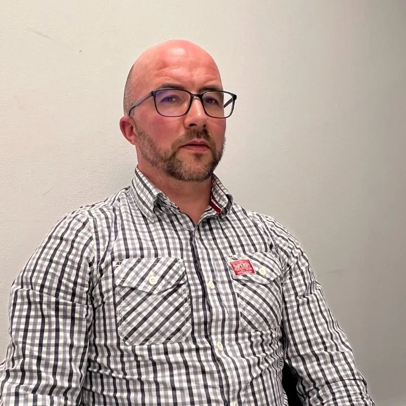 Mark bald white stares at camera